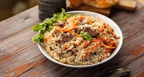 Плов с&nbsp;бараниной в&nbsp;казане на&nbsp;костре